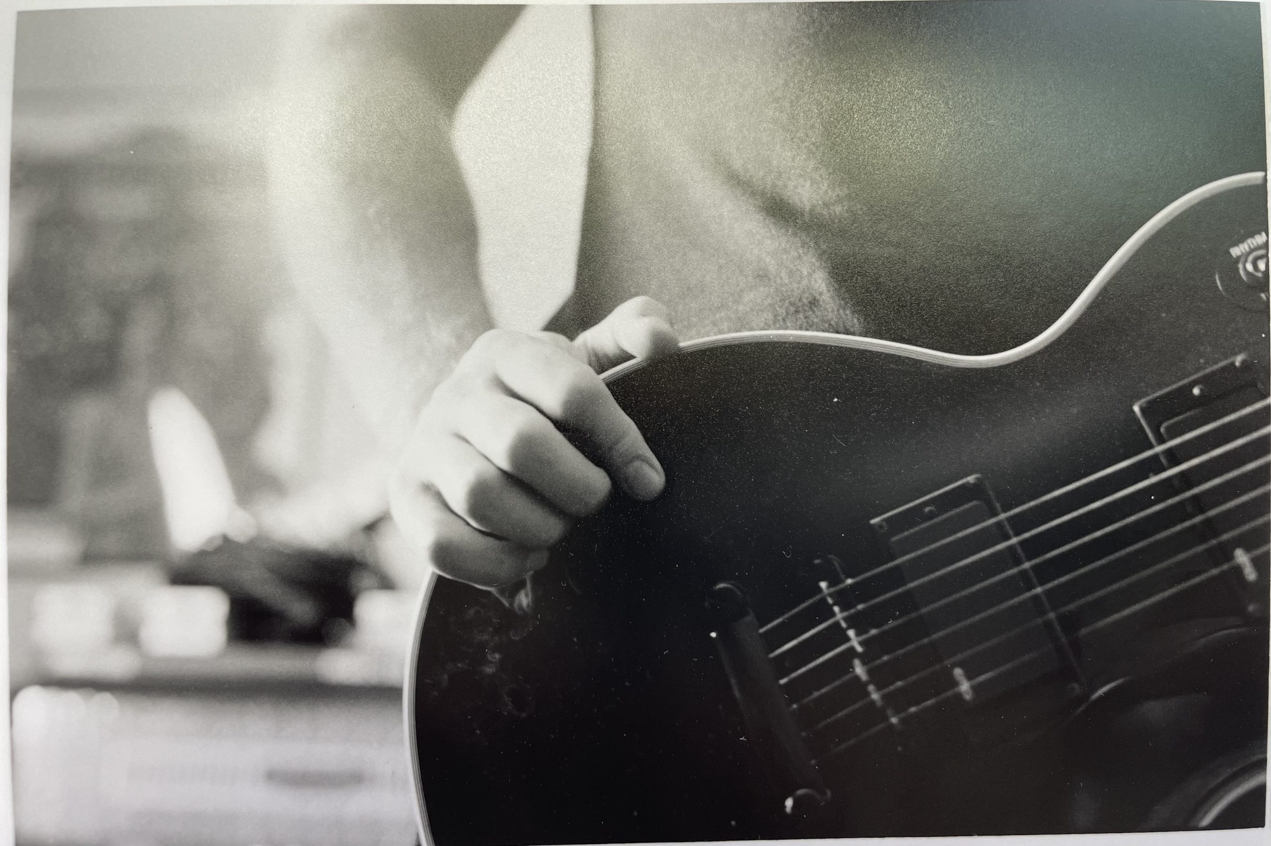 guitar being worn by man